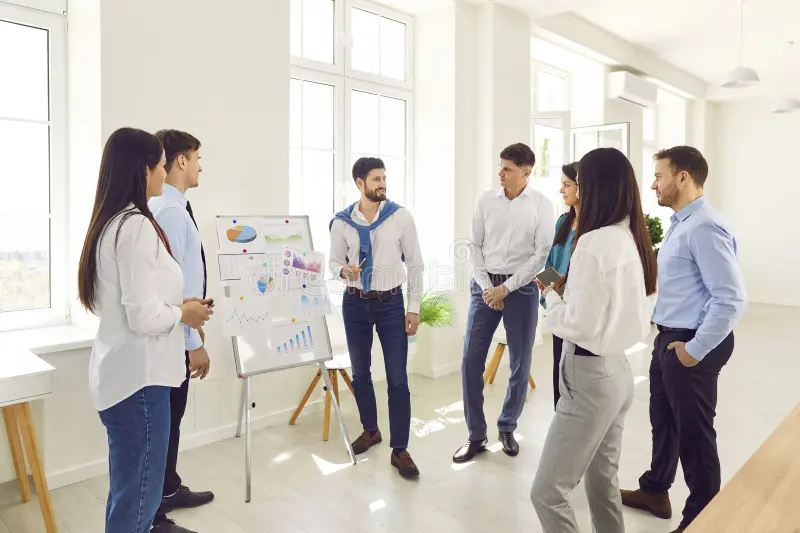 office motivated corporate male teacher training interns teaching employees coaching team business students speaking 363471531